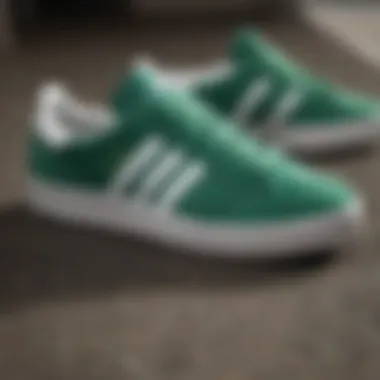 Detailed view of the design elements of collegiate green Adidas shoes