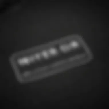 A close-up of fabric care labels on a black t-shirt, highlighting sustainability practices.