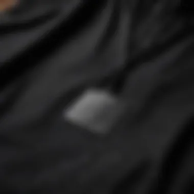 Detailed view of the Black Mike hoodie showcasing its unique fabric texture