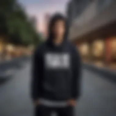 Skateboarder wearing the Black Mike hoodie in an urban skate park