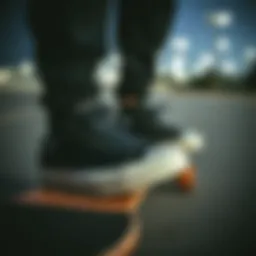 Converse All Star All Black sneakers on a skateboard