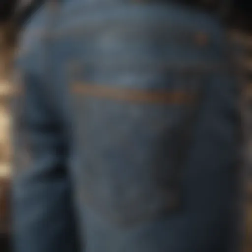 Detailed view of denim biker jeans showcasing stitching and design elements