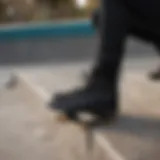 Stylish all-black Vans boots displayed on a skate park ledge