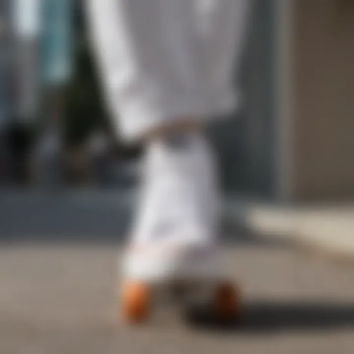 Classic all white Converse shoes on a skateboard