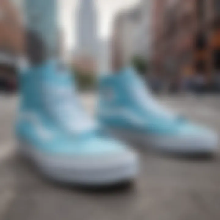 Close-up of light blue high top Vans on a city street