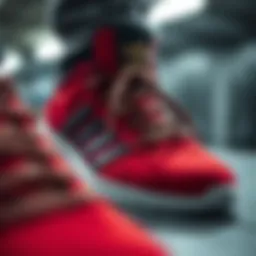 A close-up view showcasing the intricate design details of red and black Adidas skate shoes.