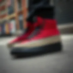 Stylish red and black hightop Vans displayed against a street backdrop