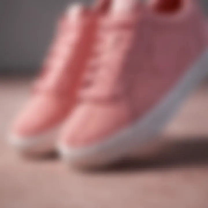 Close-up view of pink suede Nike sneakers showcasing texture and design elements