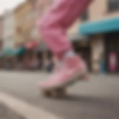 A skateboarder wearing pink suede Nike sneakers on an urban street