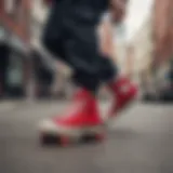 Dynamic skateboarder showcasing red and black Chucks on a vibrant urban street