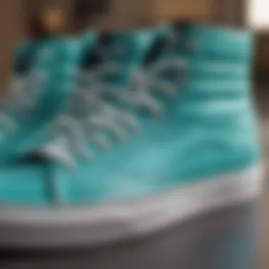 Detail view of the turquoise high top Vans highlighting craftsmanship