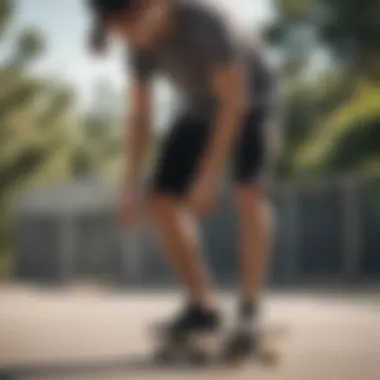 Skater adjusting their plain black shorts while preparing to ride.