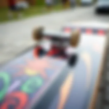 A close-up view of the graphic art on the Toy Machine skateboard deck