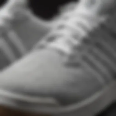 Close-up of grey and white Adidas shoes