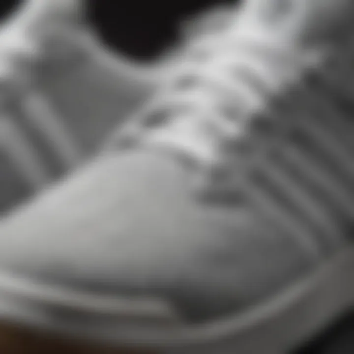 Close-up of grey and white Adidas shoes