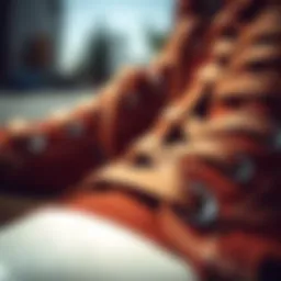 A close-up view of the intricate stitching on brown Converse shoes