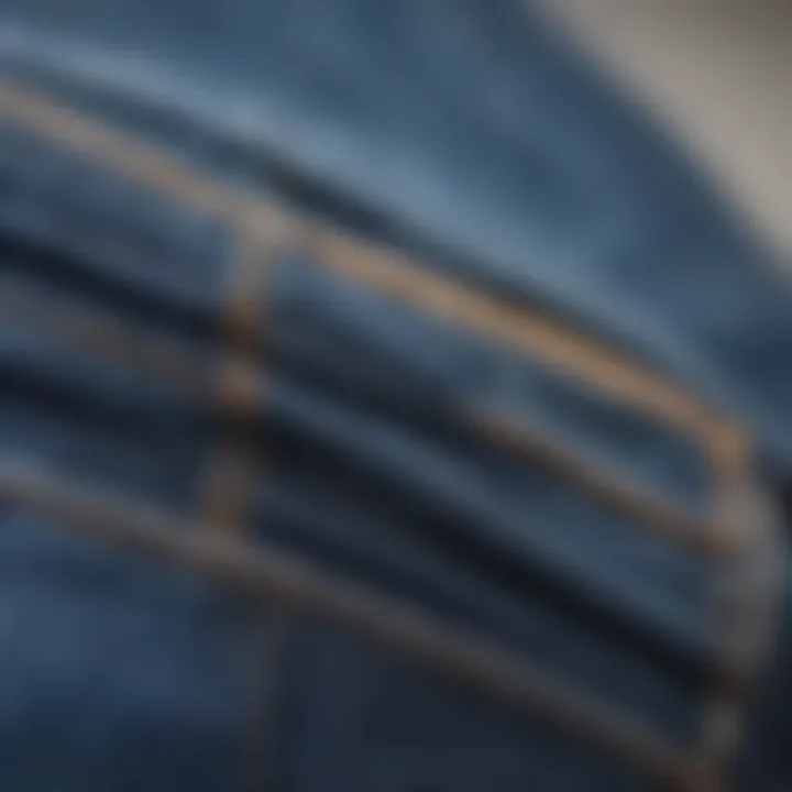 Close-up of the fabric and fit of loose blue jeans