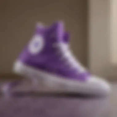 A close-up view of purple Chuck Taylor high tops showcasing their unique design elements