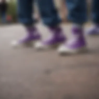 A group of skaters gathered, each showcasing their own purple Chuck Taylor high tops