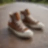 A close-up of brown Chuck Taylors on a skateboard, showcasing their design and texture.