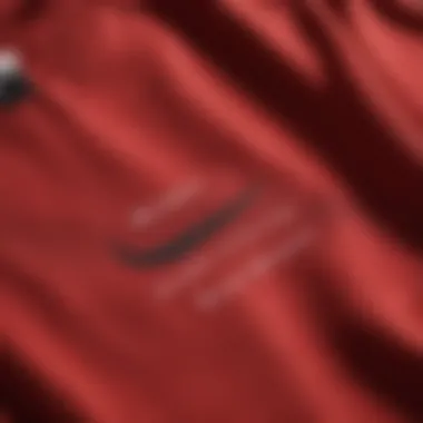 Close-up of the fabric and design details of the red Nike T-shirt