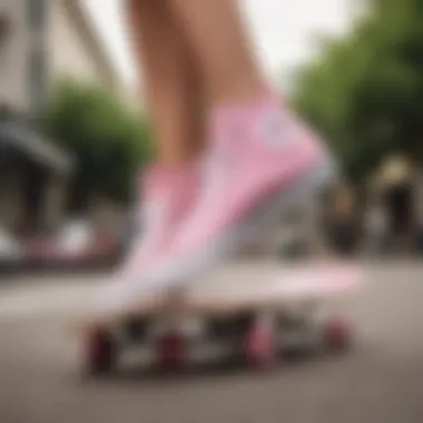 Skateboarder performing tricks while wearing pink Converse Chuck Taylor All Stars