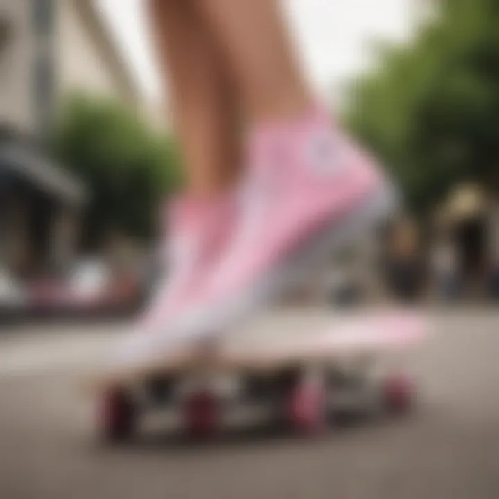 Skateboarder performing tricks while wearing pink Converse Chuck Taylor All Stars