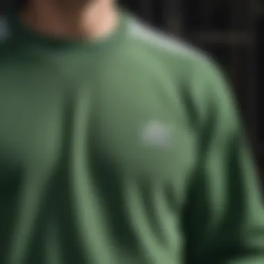 Close-up of fabric and stitching on the green sweatshirt