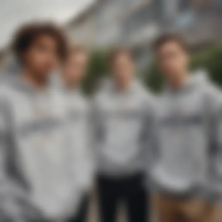 A group of skateboarders gathered in a relaxed setting, all wearing grey champion sweatshirts, illustrating its social significance.