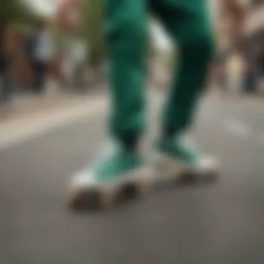 Skater performing a trick while wearing Stan Smith green sneakers