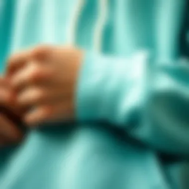 Fabric Focus: Analyzing the Mint Hoodie's Craftsmanship Close-up of mint hoodie fabric and design details