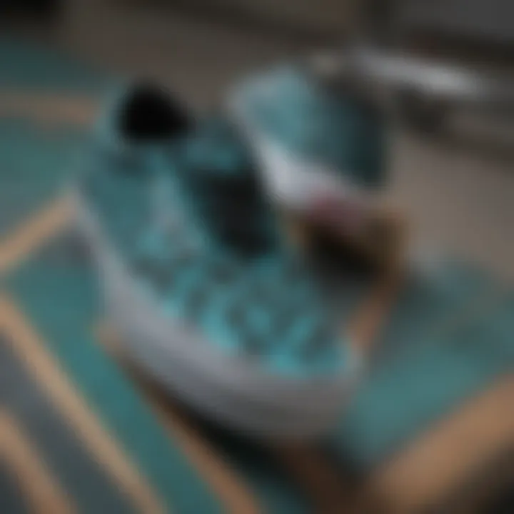 Close-up of teal and black checkered Vans on a skateboard