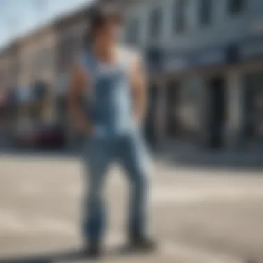 Stylish skater wearing light wash denim overalls in an urban setting