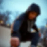 Skateboarder in Action A skateboarder wearing a black zip-up hoodie with white strings performing a trick