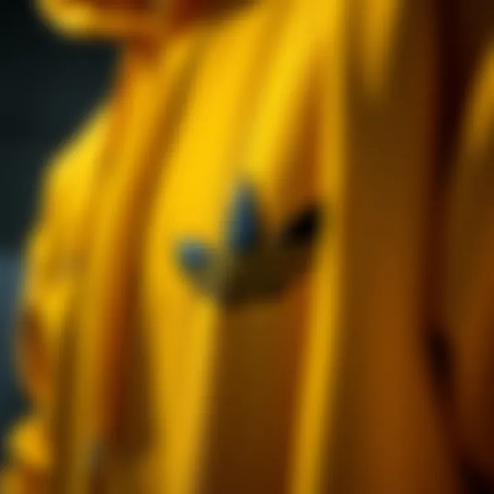 The Texture of Style Close-up of the yellow Adidas hoodie showcasing its fabric texture