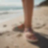 Stylish Vans Cayucas sandals on a vibrant beach background