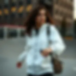 Stylish white zip-up hoodie in an urban skate park setting